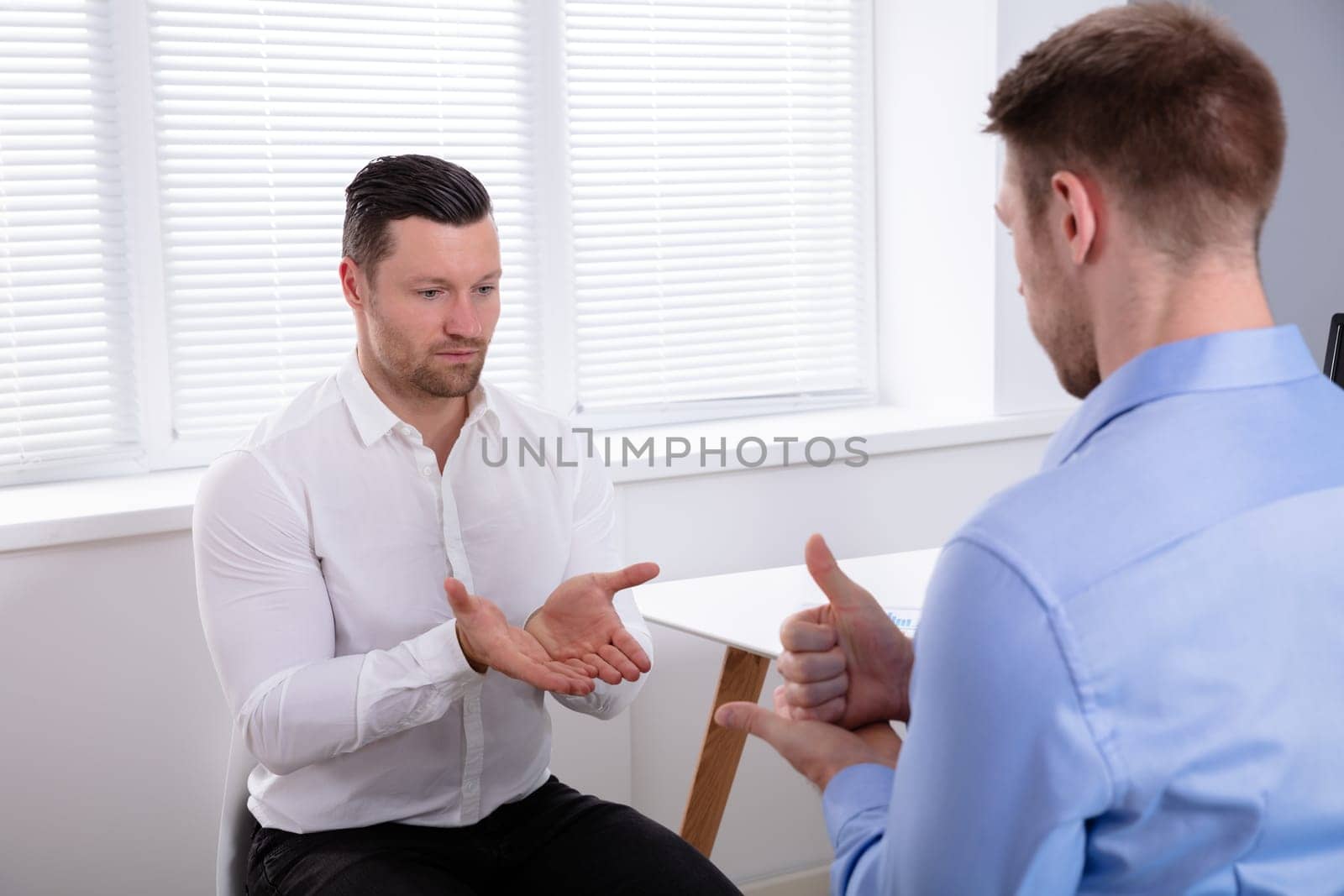 Two Hearing Impaired Friends Using Sign Language For Communication