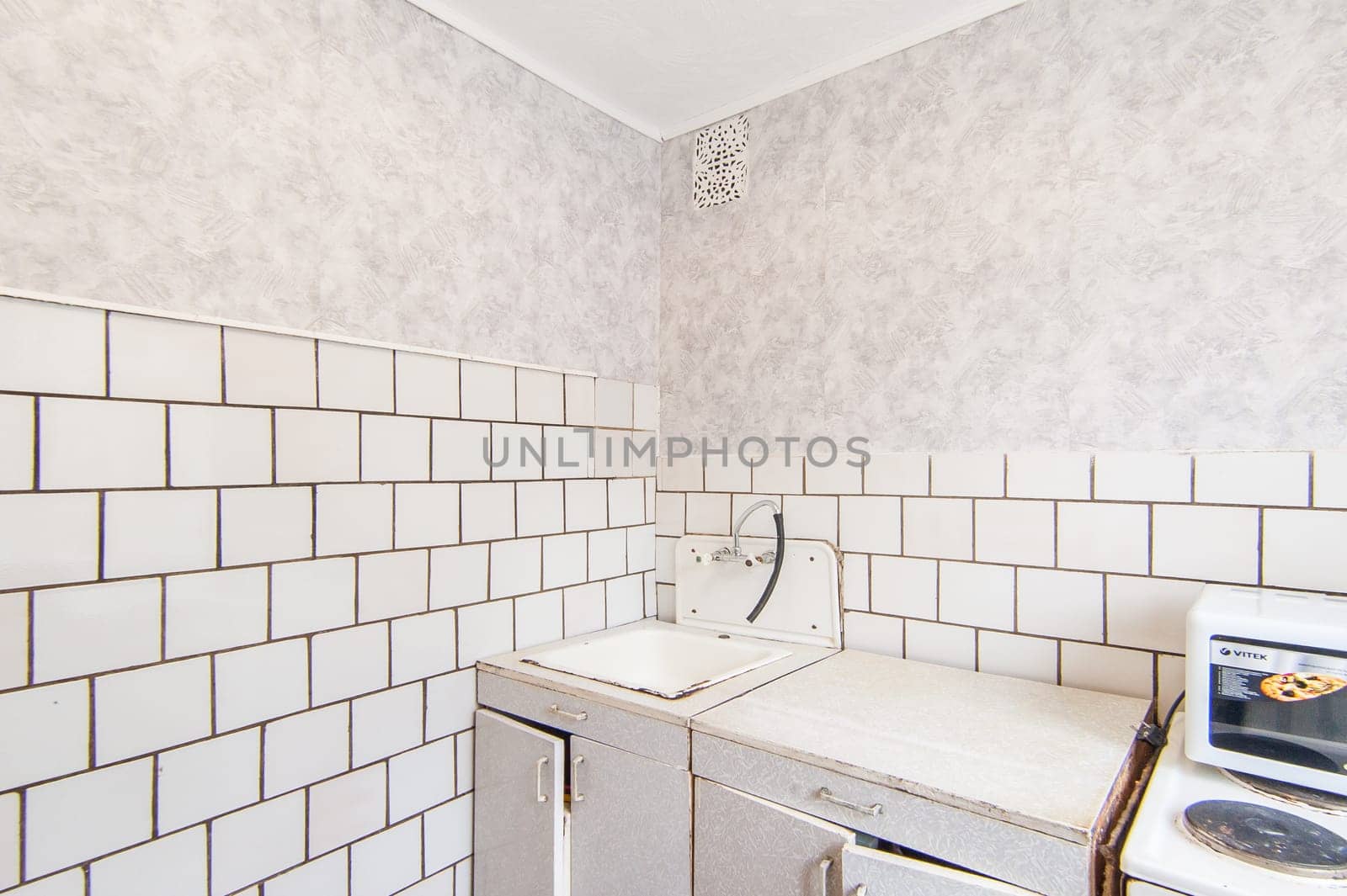 Russia, Moscow- May 16, 2019: interior room apartment. standard repair decoration in hostel. kitchen and dining room