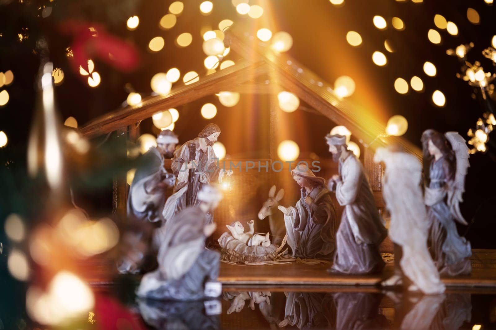 Christmas Manger scene with figurines including Jesus, Mary, Joseph, sheep and wise men. Focus on baby!