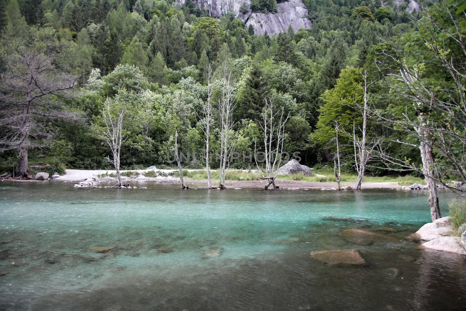 Cyan water in Val di Mello in Italy