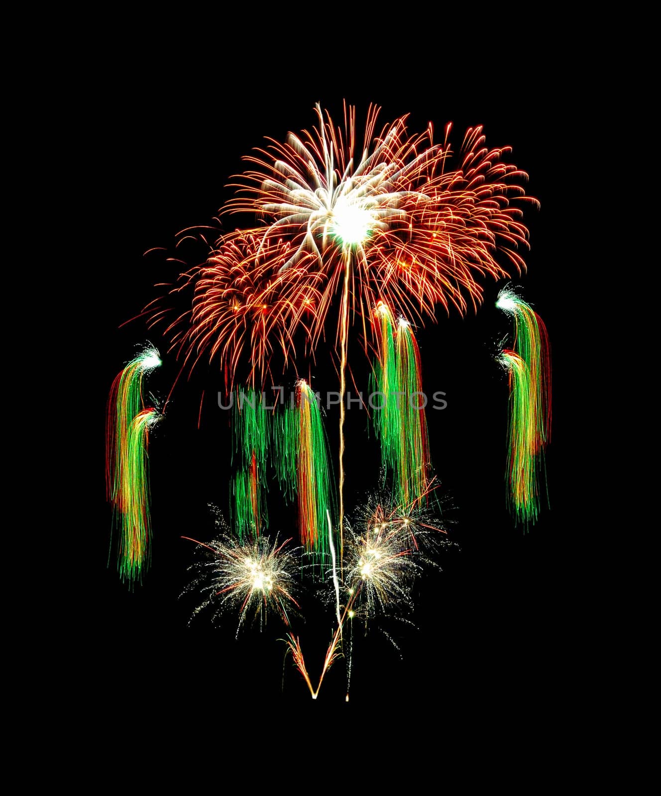 Beautiful colorful fireworks exploding in the night sky, isolated on black background. New year and anniversary concept.