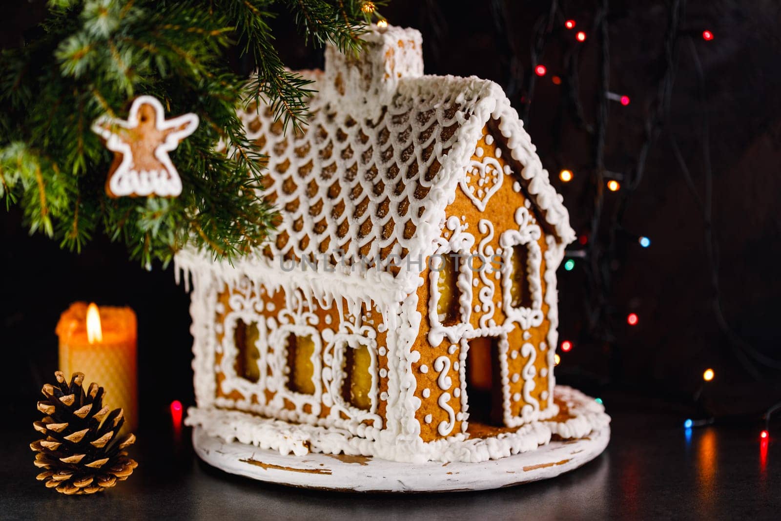 beautiful handmade gingerbread house for Christmas and New Year, dark backround, selective focus