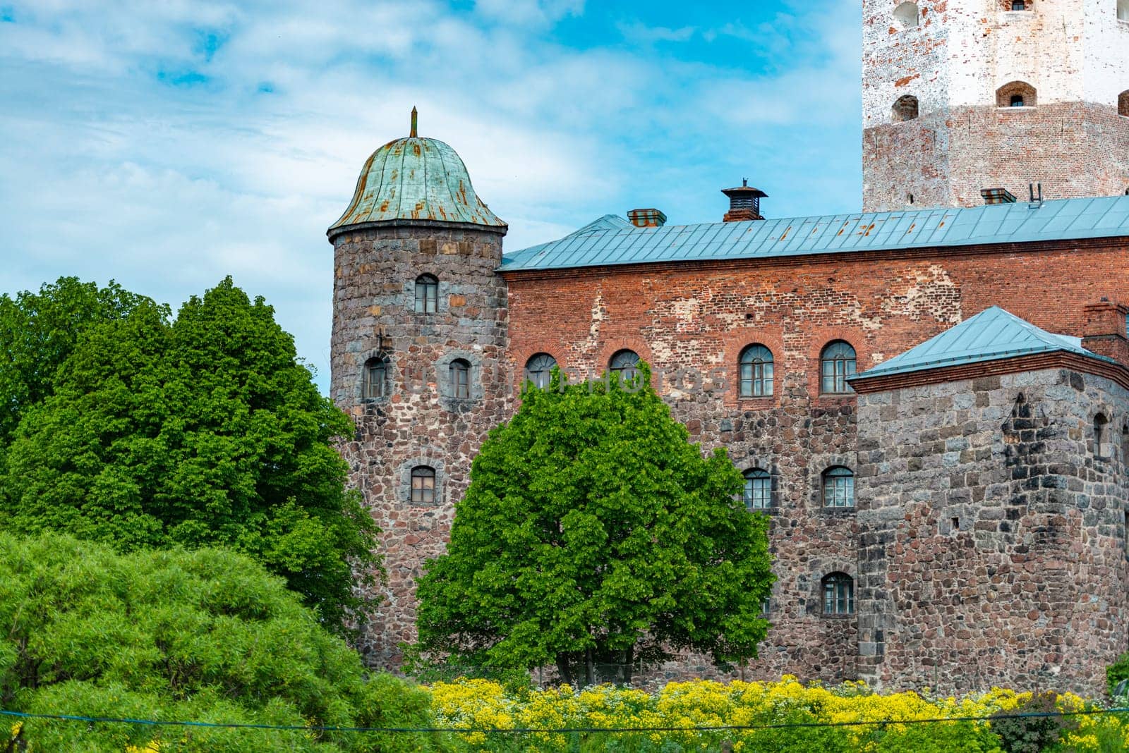 Architecture of old town Vyborg, Russia, Europe. Saint Olaf tower and Vyborg castle on summer day.