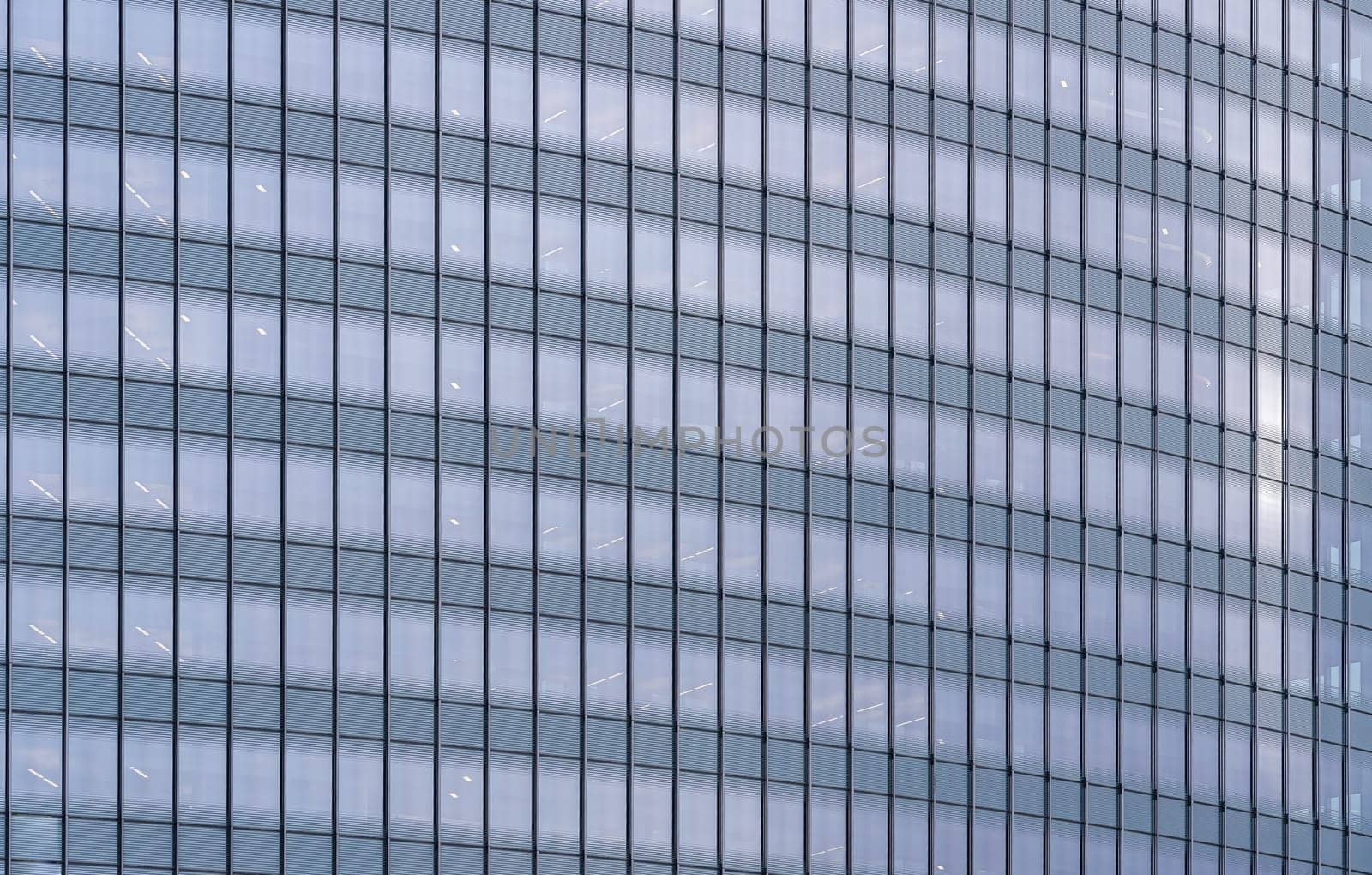 Urban abstract - window facade of business center office building with reflections and colours. Philadelphia PA USA