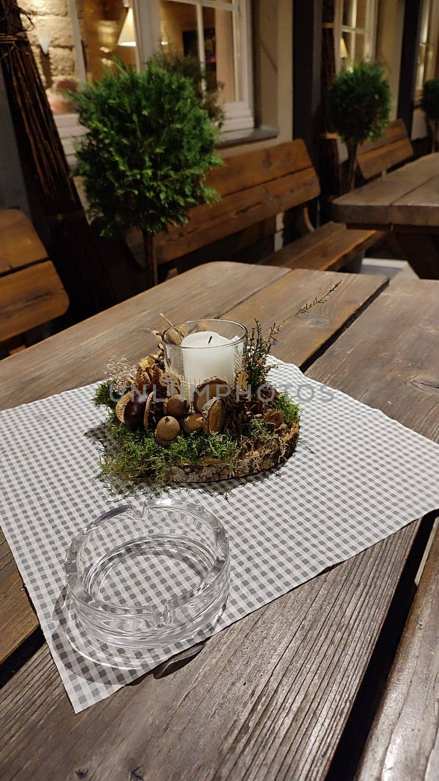 white candle candlestick ashtray wooden table objects cafe restaurant. High quality photo