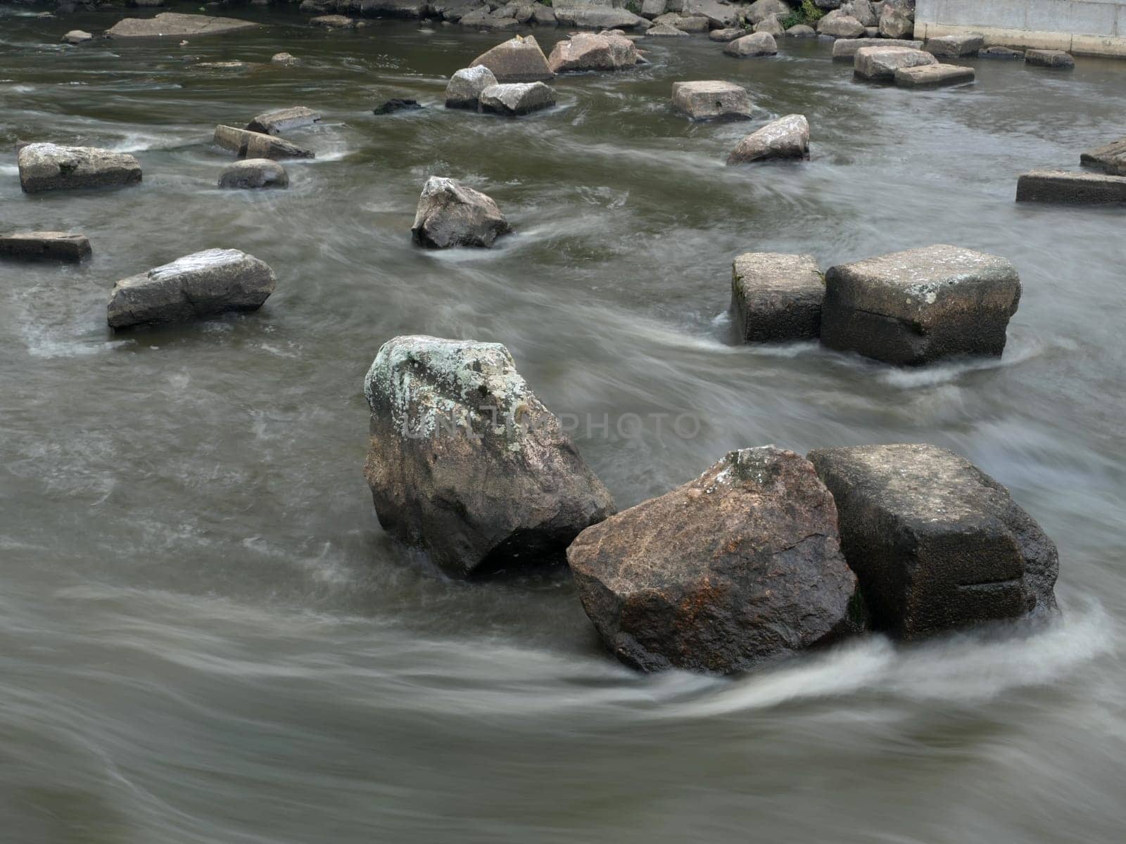 Fast  river among stones. Long exposure