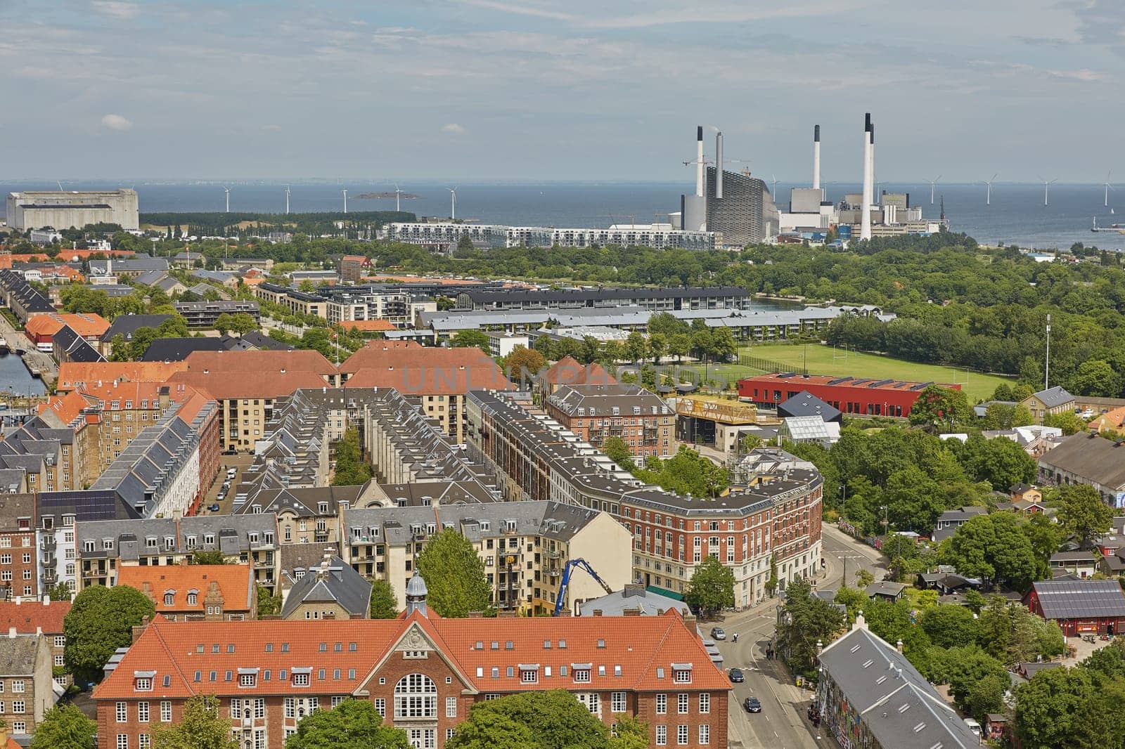 COPENHAGEN, DENMARK - JUNE 28, 2017: Skyline of scandinavian city of Copenhagen in Denmark during a cloudy day.