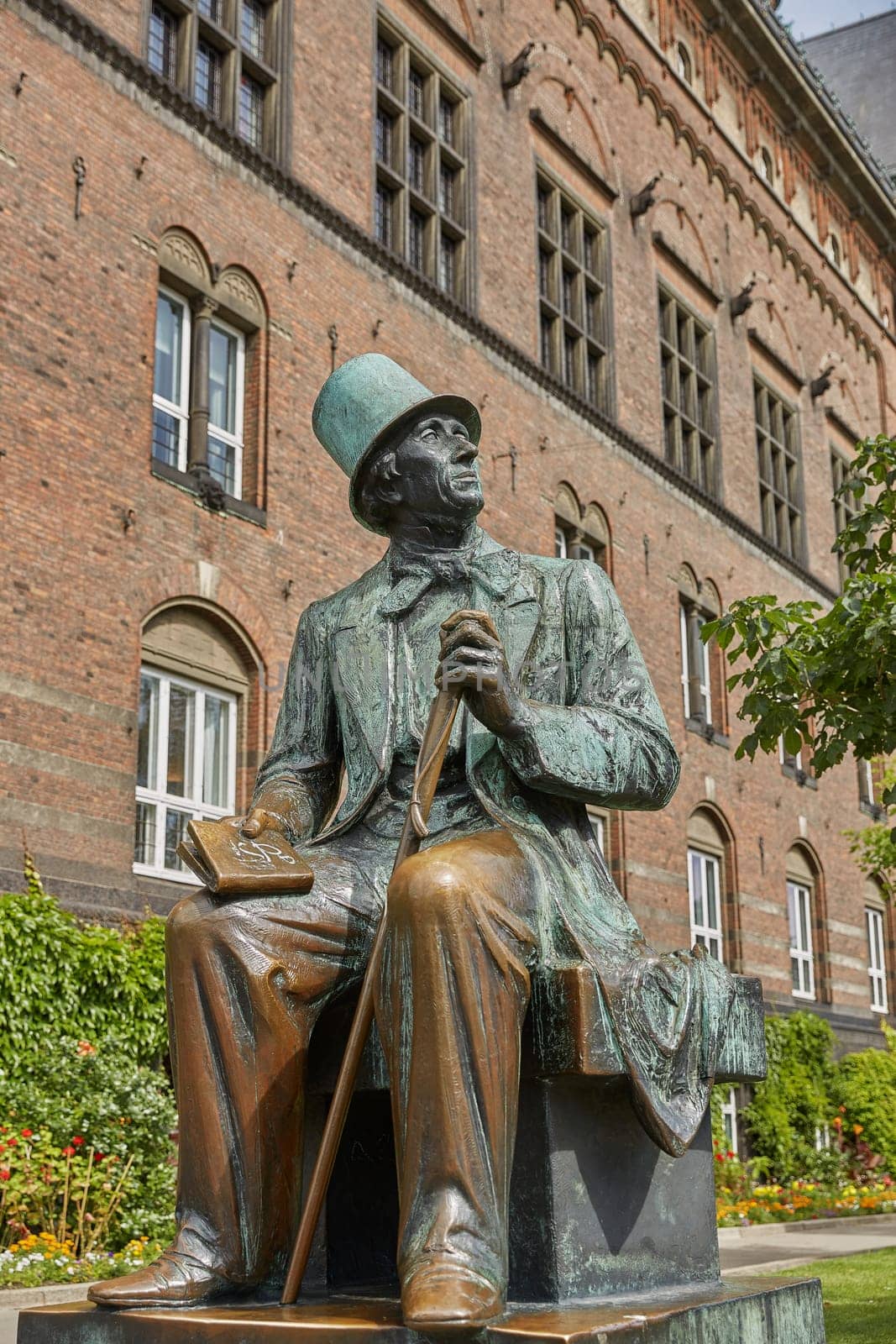 COPENHAGEN, DENMARK - JUNE 28, 2017: Hans Christian Andersen statue by Henry Luckow-Nielsen in front of Tivoli Aumusement Park in Copenhagen, Denmark.