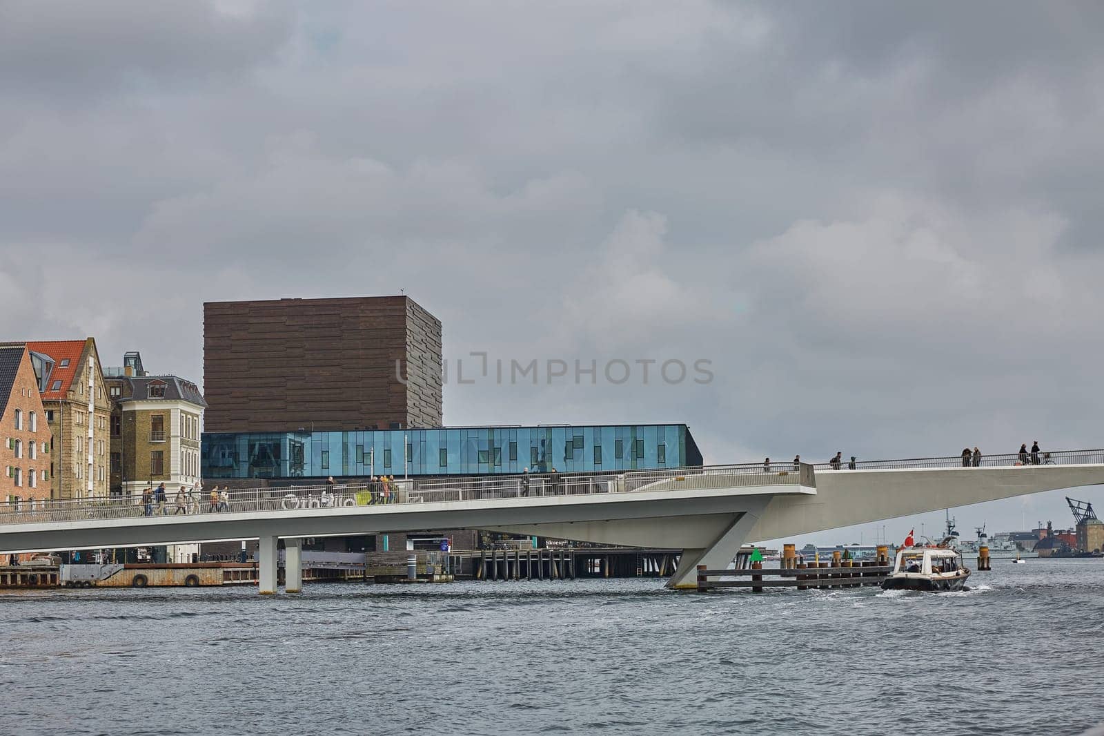 COPENHAGEN, DENMARK - MAY 25, 2017: Modern building of the New Royal Playhouse Theater in historic city center facing famous Copenhagen waterfront, Nyhavn, Denmark.