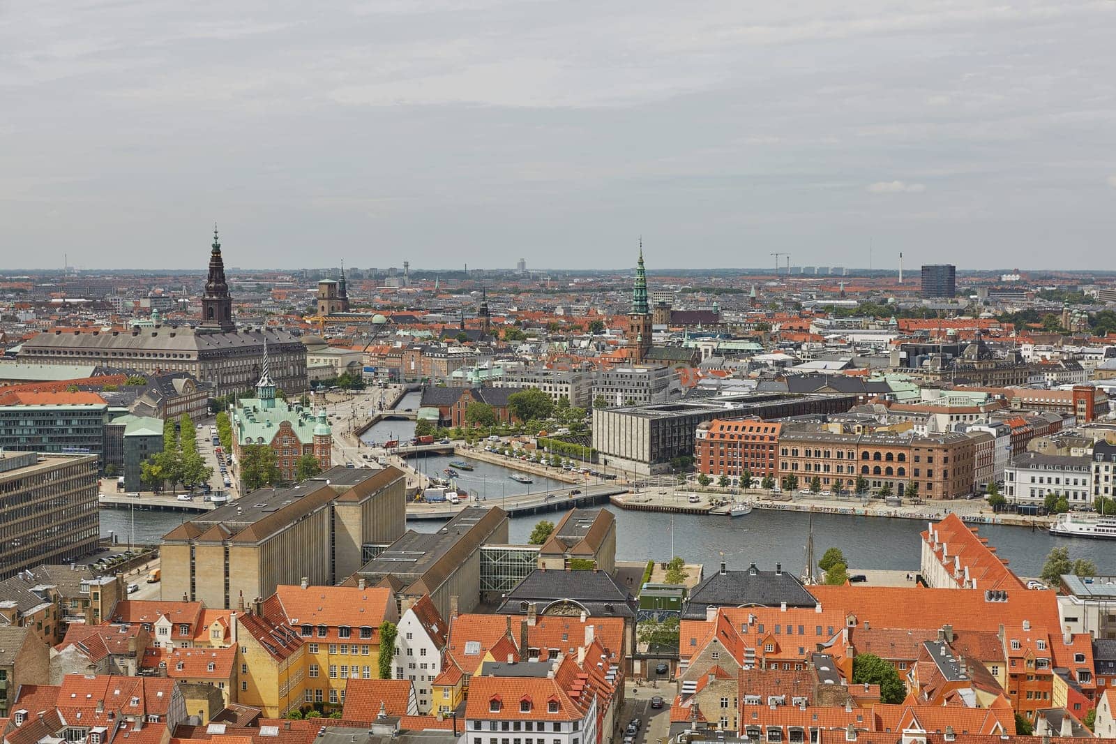 COPENHAGEN, DENMARK - JUNE 28, 2017: Skyline of scandinavian city of Copenhagen in Denmark during a cloudy day.