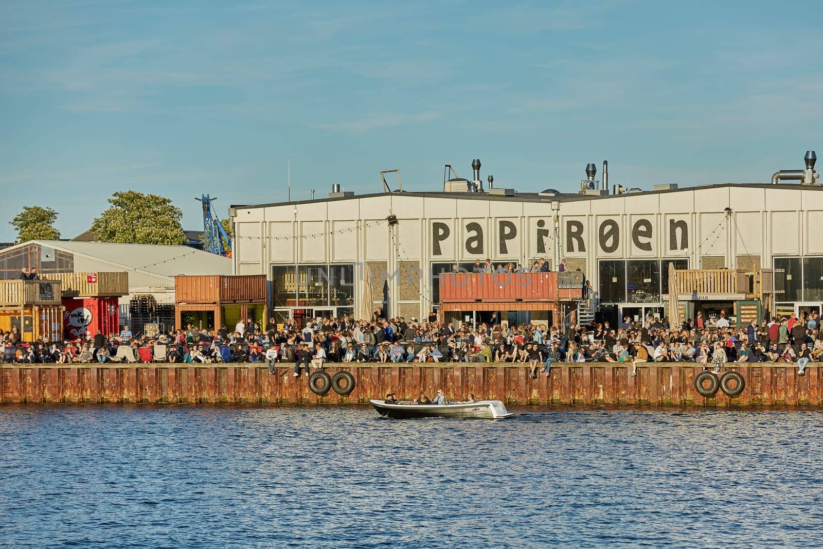 COPENHAGEN, DENMARK - MAY 25, 2017: Street food market Papiroen on the paper island in Copenhagen with a lot of people on the quay.