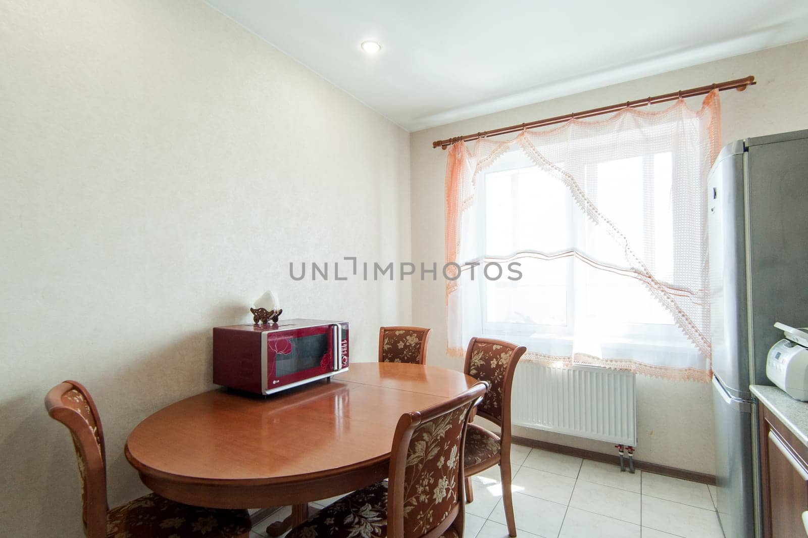 Russia, Moscow- May 20, 2019: interior room apartment. standard repair decoration in hostel. modern kitchen, dining area