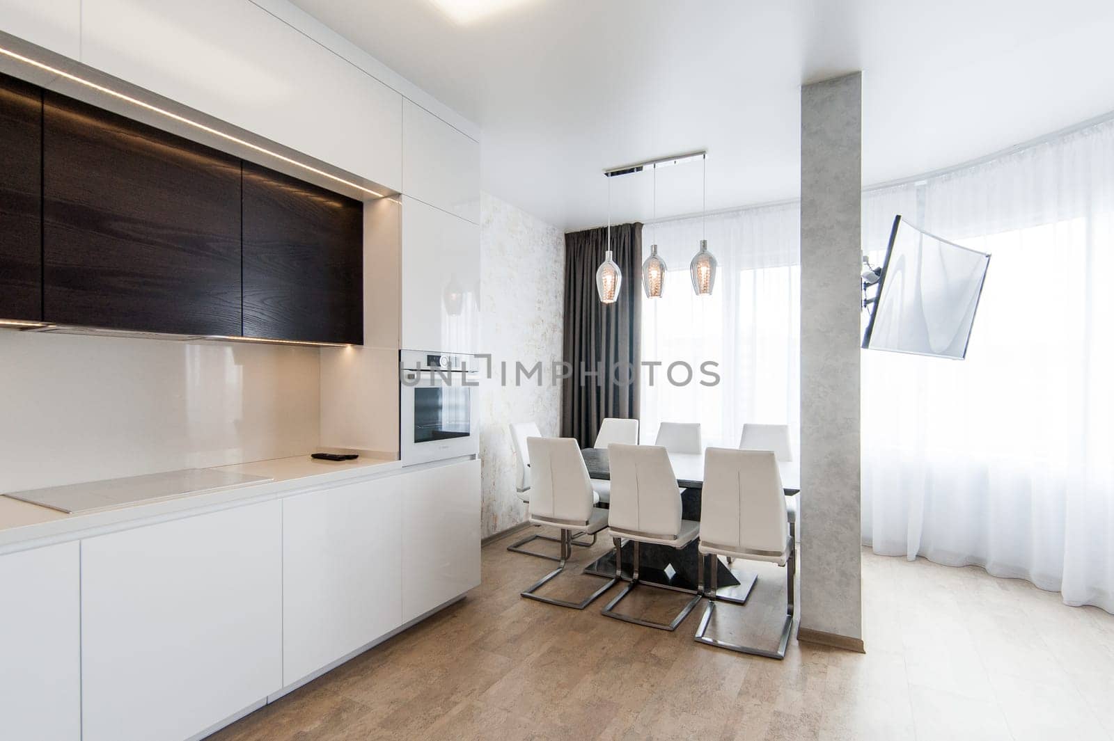 Russia, Moscow- May 20, 2019: interior room apartment. standard repair decoration in hostel. modern kitchen, dining area
