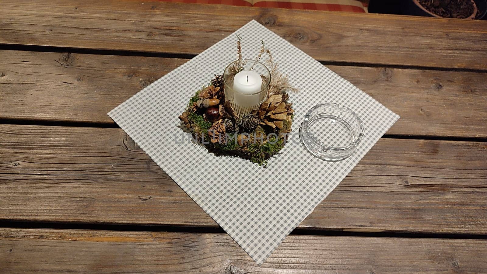white candle candlestick ashtray wooden table objects. High quality photo