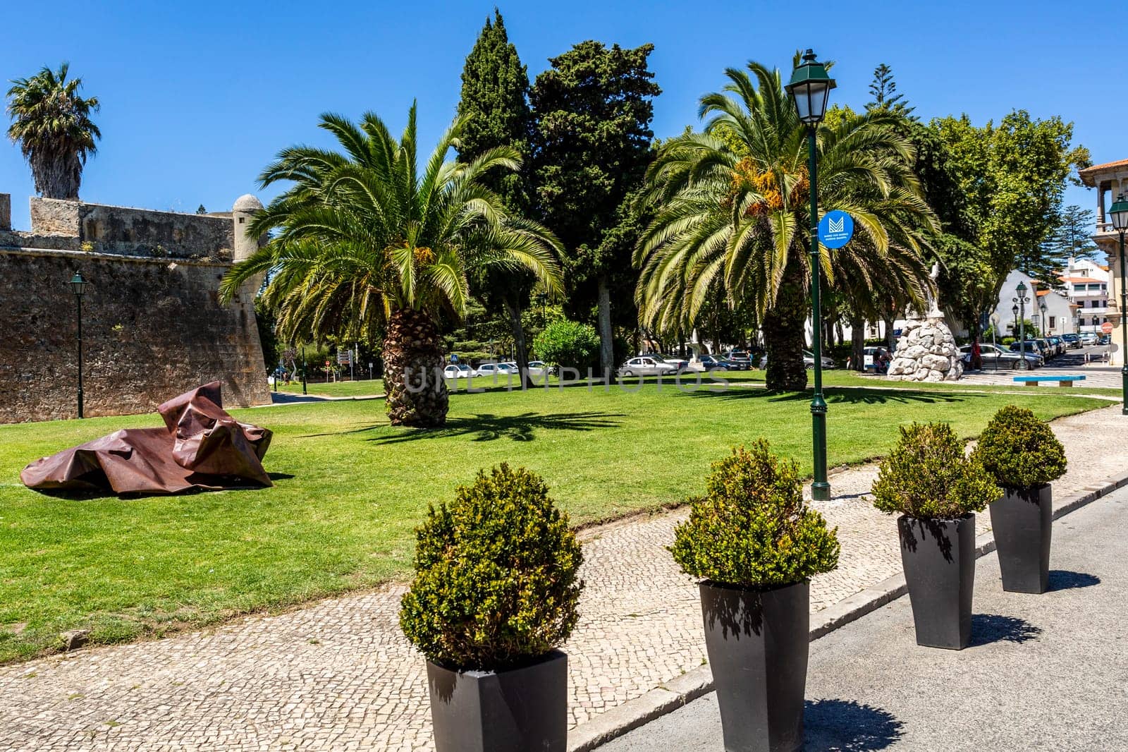 View of the square and the fortress rampart in front of the entrance to the Citadel of Cascais, Portugal
