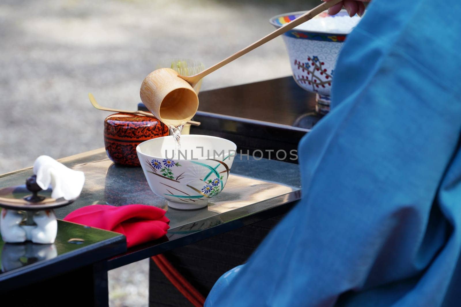 Japanese women in kimono prepares the macha green tea ceremony