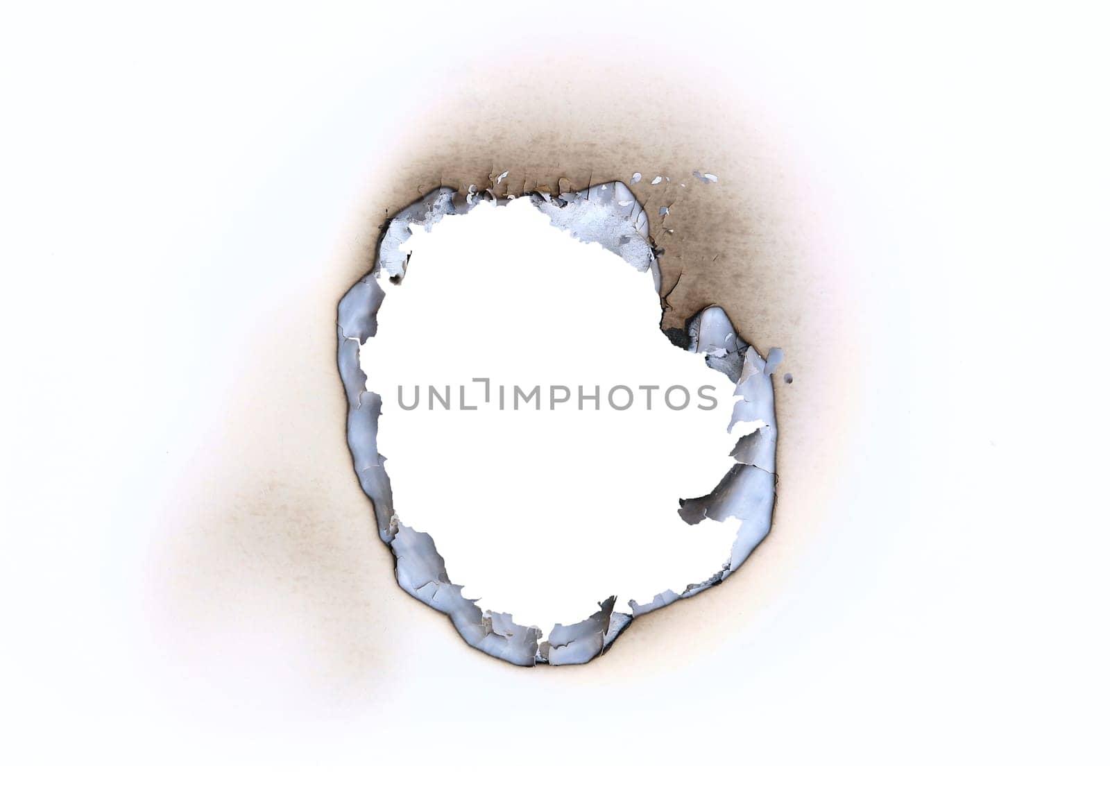 Detail of the burnt throughhole in a blank paper