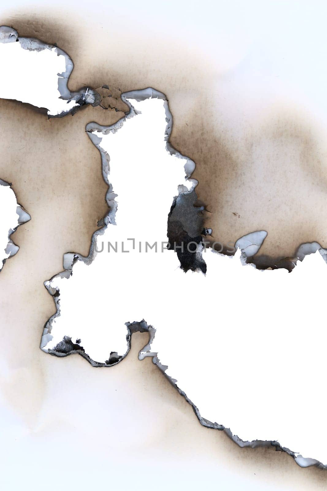 Burnt all through blank sheet of a paper - detail