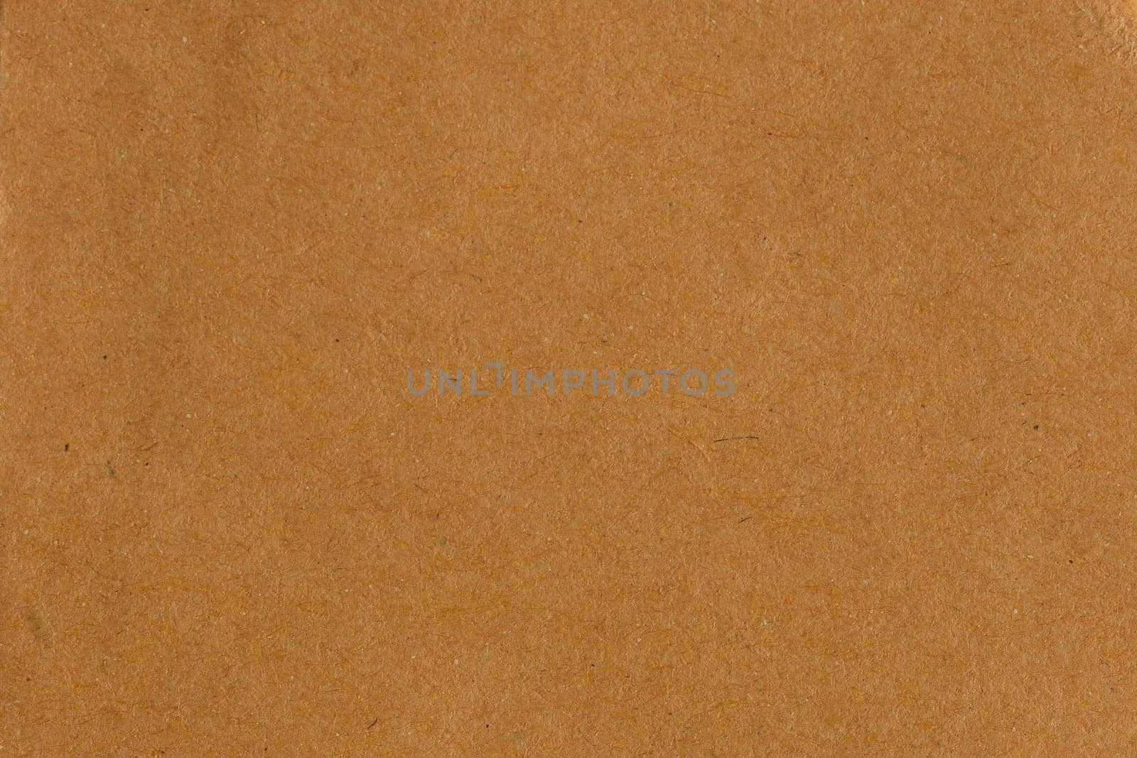 Brown recycled cardboard paper abstract background texture.