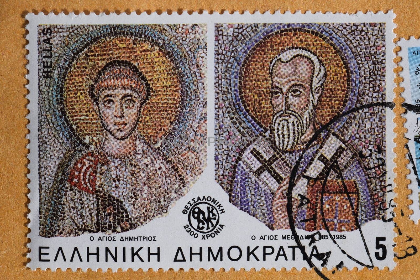 GREECE - CIRCA 1985: Saints Demetrius and Methodius of Thessaloniki detail from byzantine era mosaic on vintage postage stamp printed by the Hellenic Post.