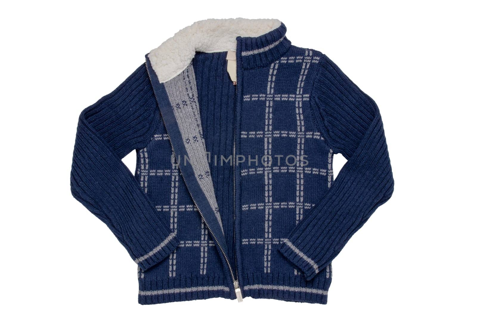 Autumn and winter children clothes. A cozy warm dark blue cardigan or jacket with a white checkered pattern for the little boy isolated on a white background. Kids spring fashion.