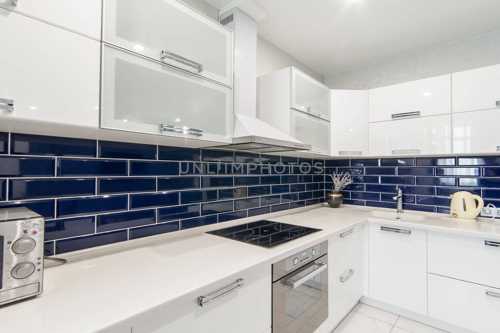 Russia, Moscow- May 21, 2019: interior room apartment. standard repair decoration in hostel. modern kitchen, dining area