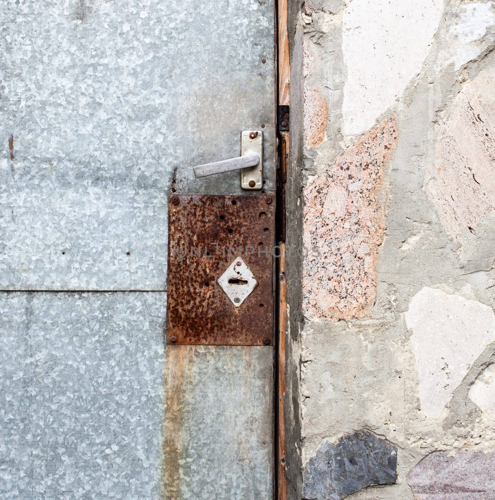 Old iron door with lock. Close up