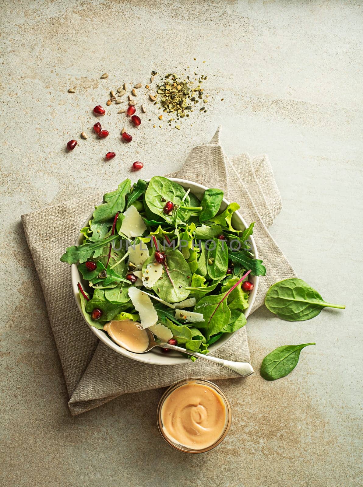 Healthy green salad with spinach and seeds. Home made meal. Concept for a tasty and healthy meal.