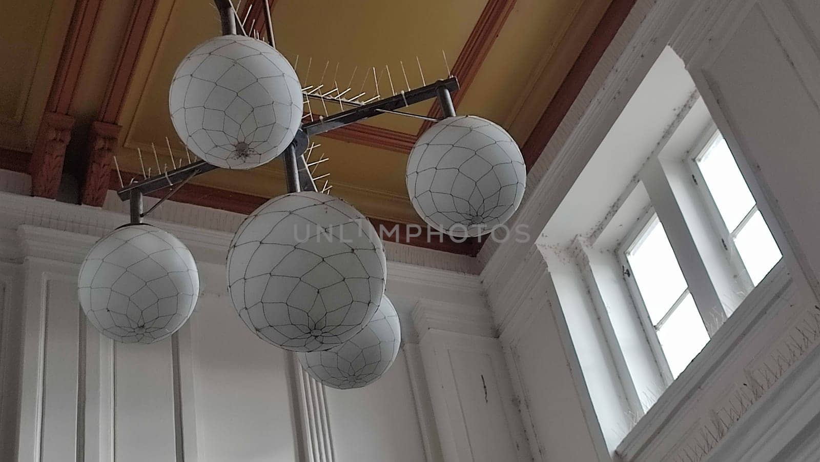 white round chandelier lamp balls ceiling window objects interior design building wall . High quality photo