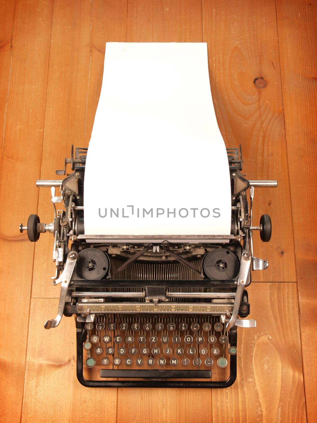 Old vintage typewriter with a blank letter
