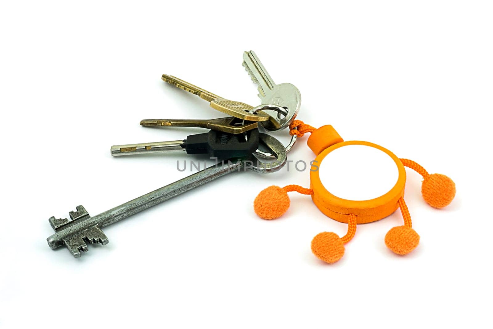A bunch of keys with a keyring on a white background