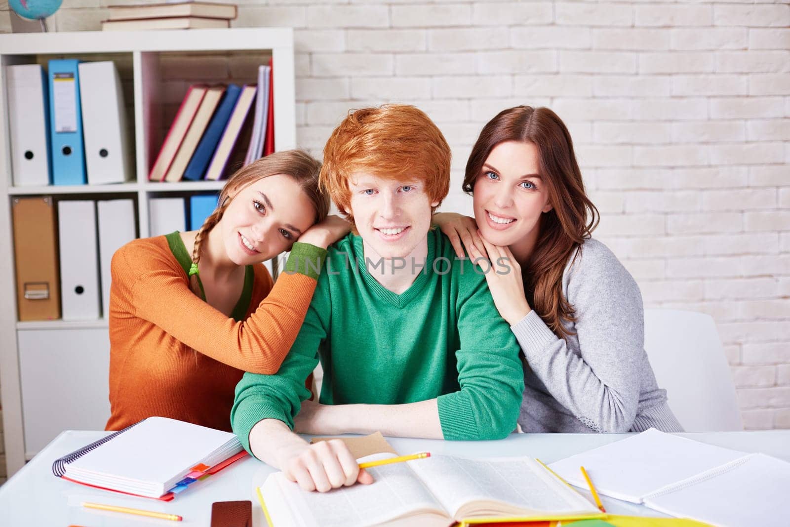 Group of friendly students looking at camera