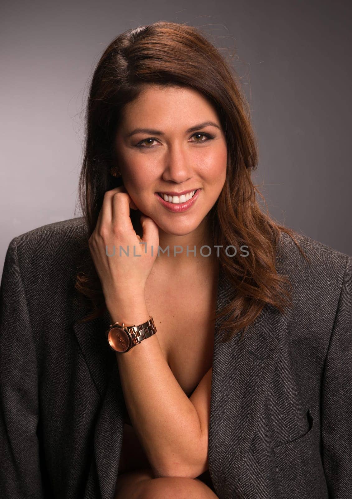 Hip young brunette woman adorned only in a man's sport coat