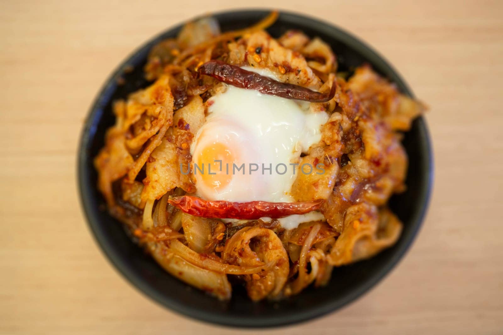 Pork sliced in red hot spicy Korean sauce rice bowl, stock photo