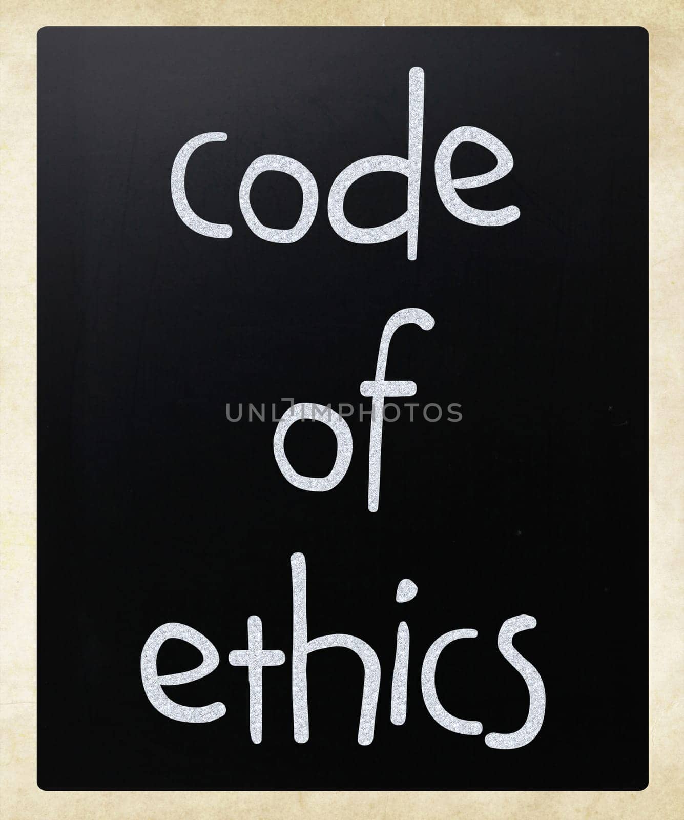 "Code of ethics"" handwritten with white chalk on a blackboard"