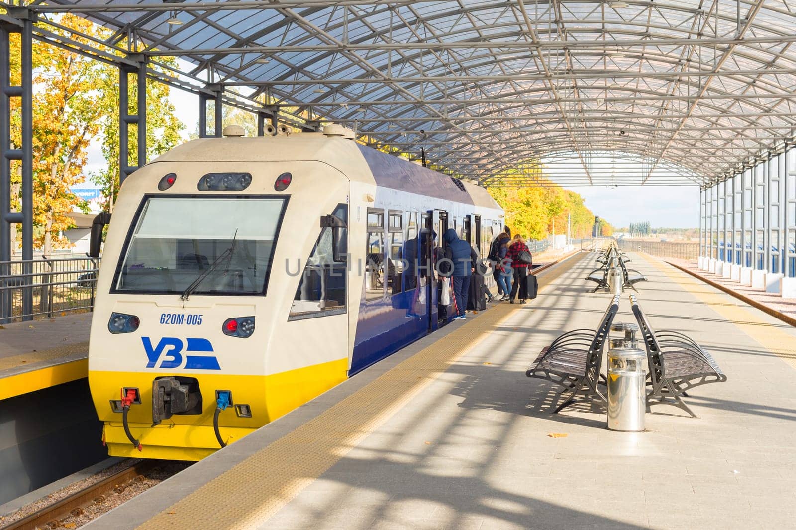 KYIV, UKRAINE - OCTOBER 07, 2019: People boarding Boryspil Express train - shuttle airport train from Kyiv Central train station to the Boryspil airport terminal