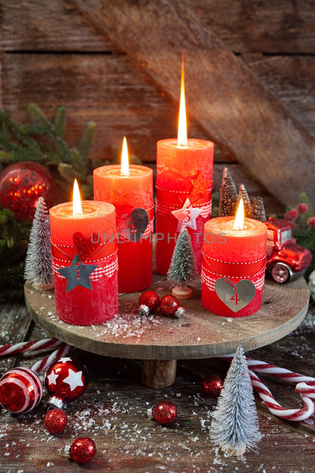 Colorful burning candles and festive decorations for Christmas