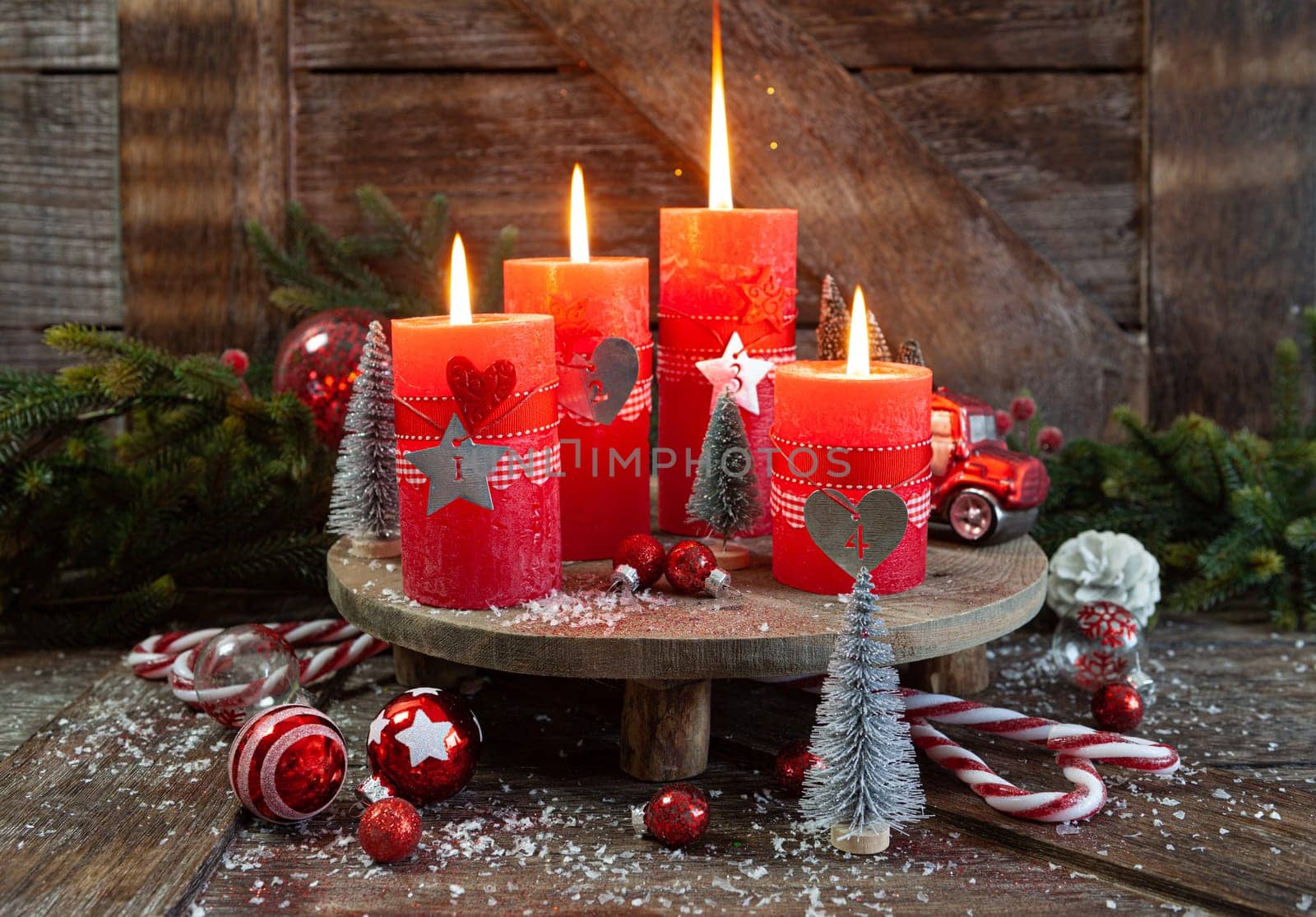 Colorful burning candles and festive decorations for Christmas