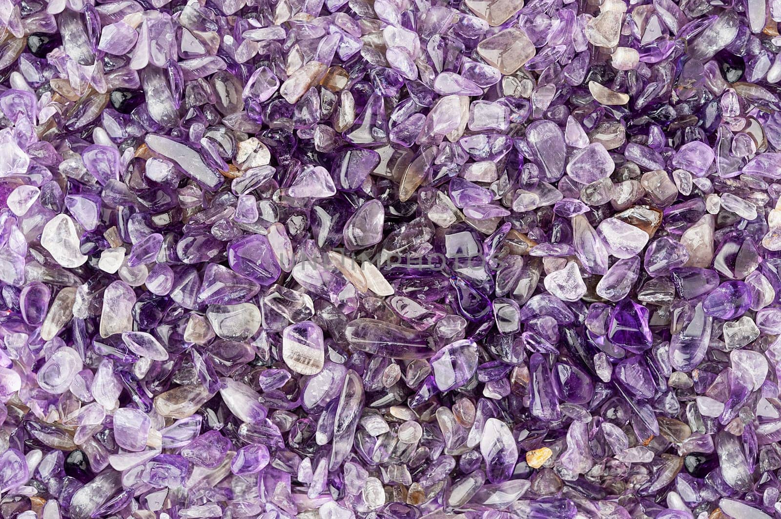 Small rounded amethyst stones textured background