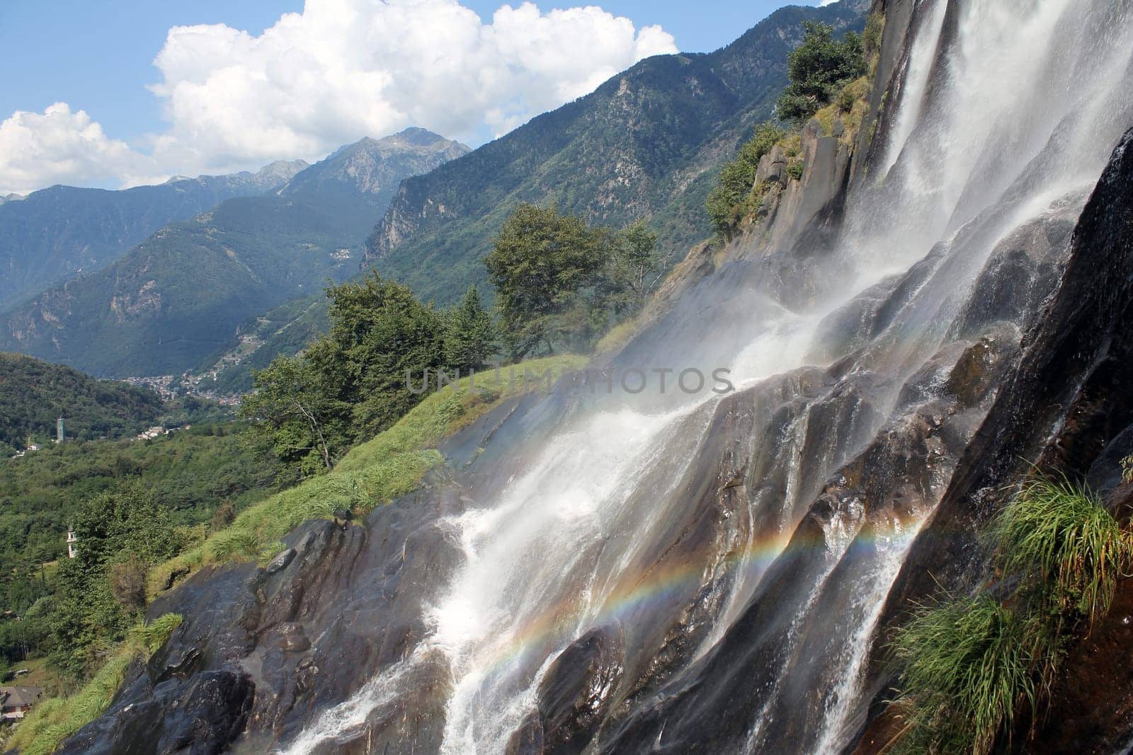 Smashing waterfall with rainbow in Italy