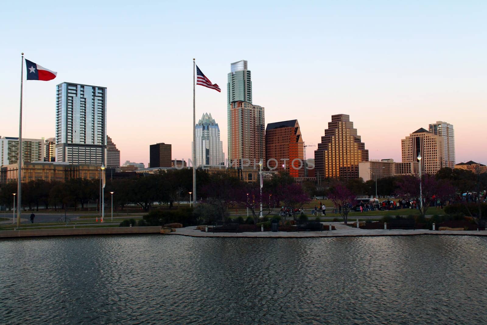Austin buildings, flags and river in Texas