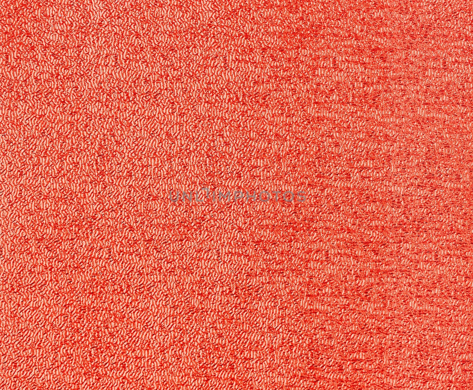 Red glitter foil textured background closeup