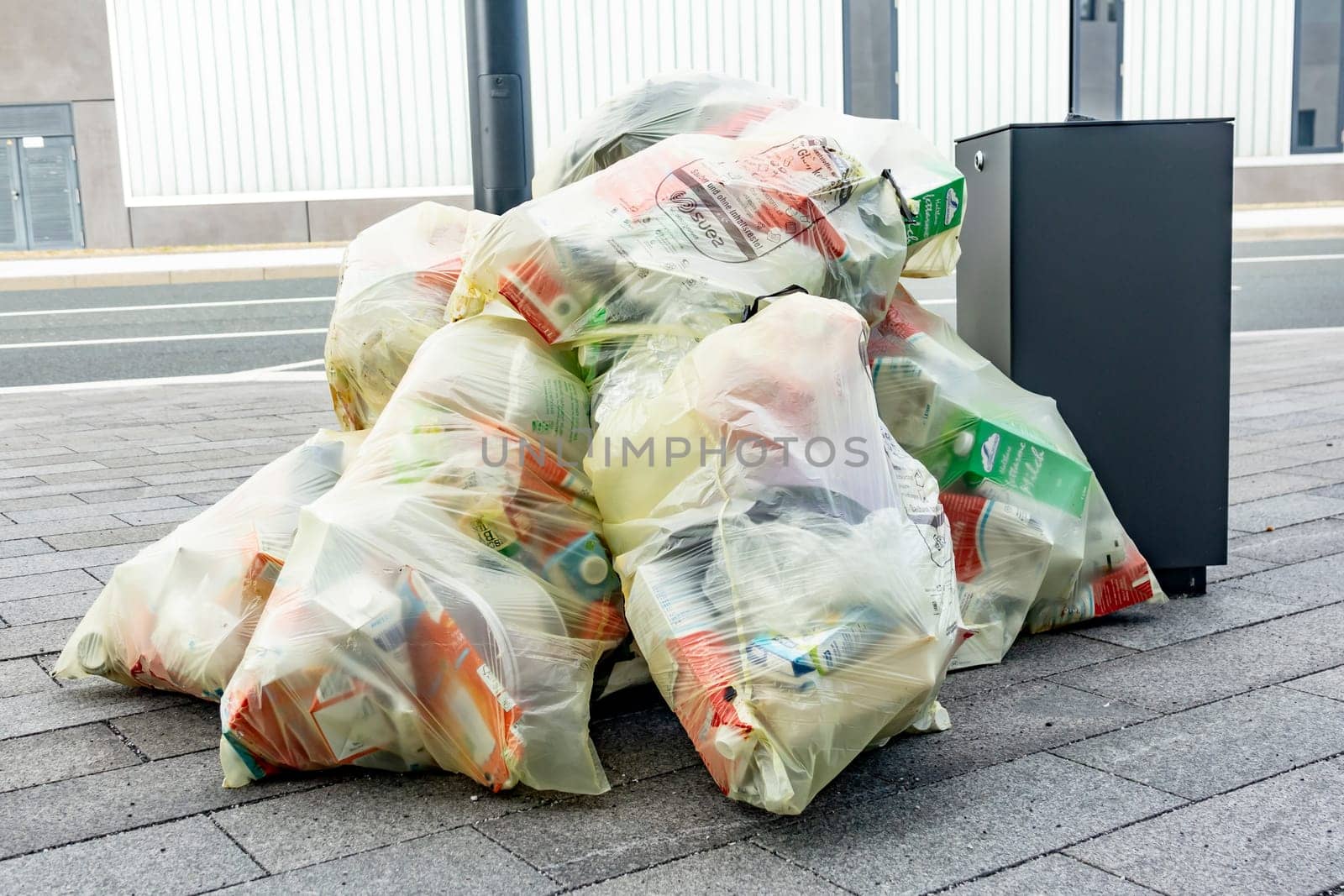 WETZLAR, FGERMANY- 05th of SEPTEMBER 2019 - Many transparent bags with garbage and wastes piled up in a heap