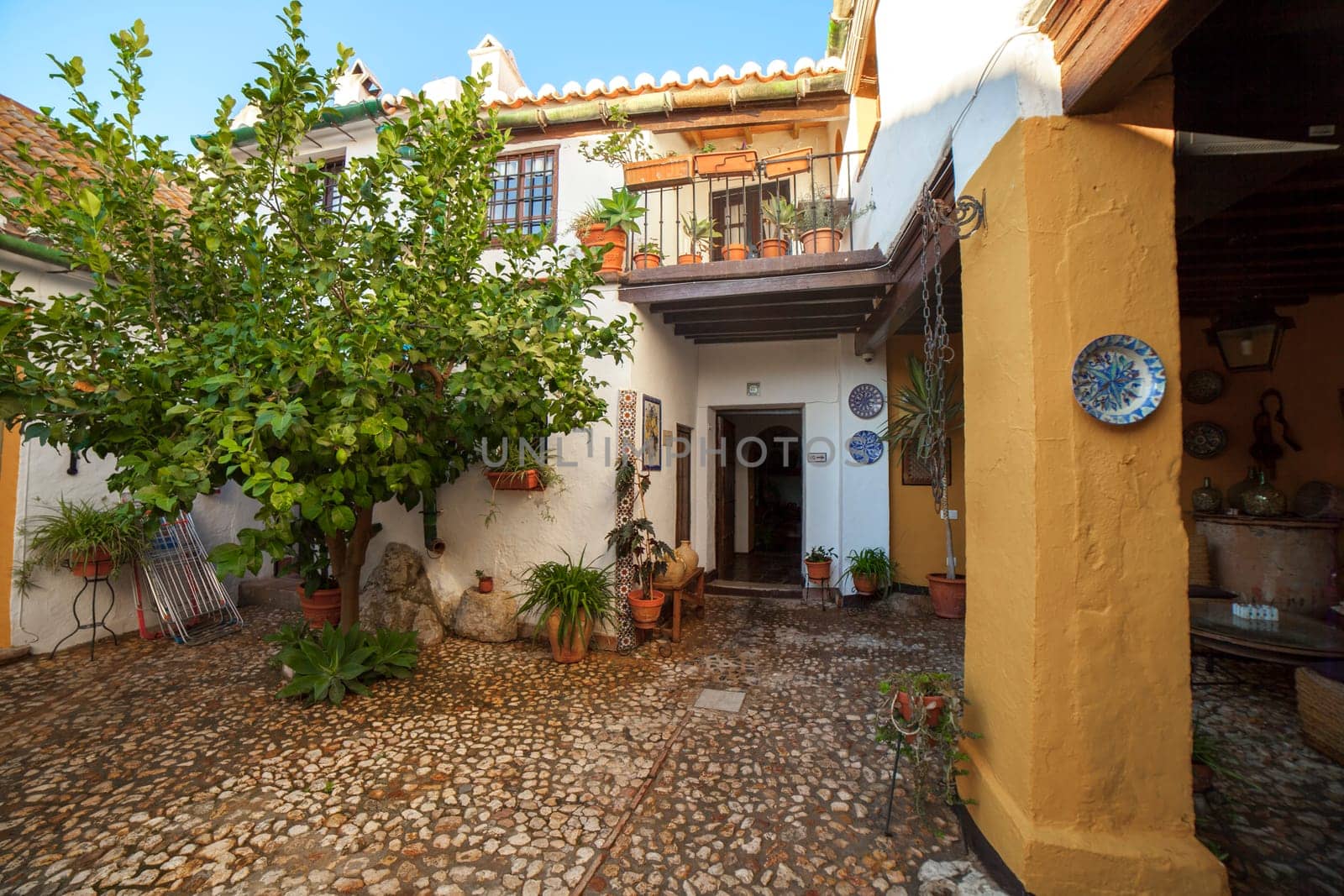 Comares, Spain - Sept 23th, 2018: Courtyard of Molino De Los Abuelos Hotel, built with typical axarquia architecture. Comares, Malaga Province, Andalusia, Spain