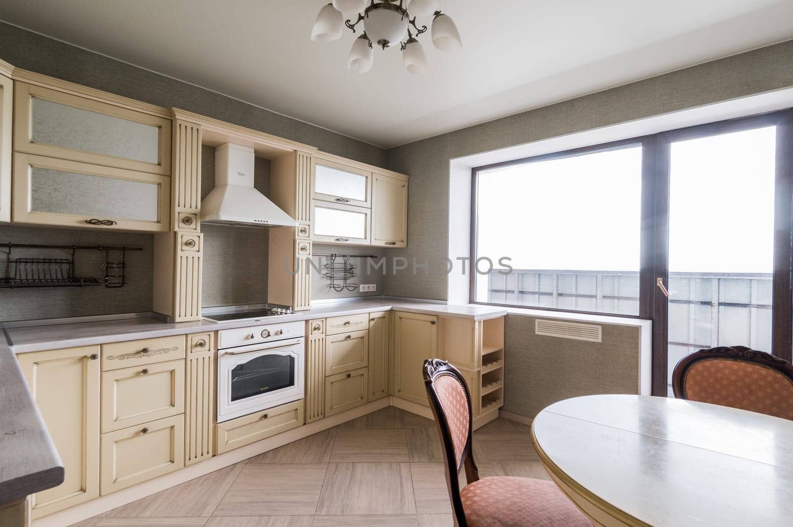 Russia, Moscow- June 11, 2019: interior room apartment. standard repair decoration in hostel. modern kitchen, dining area