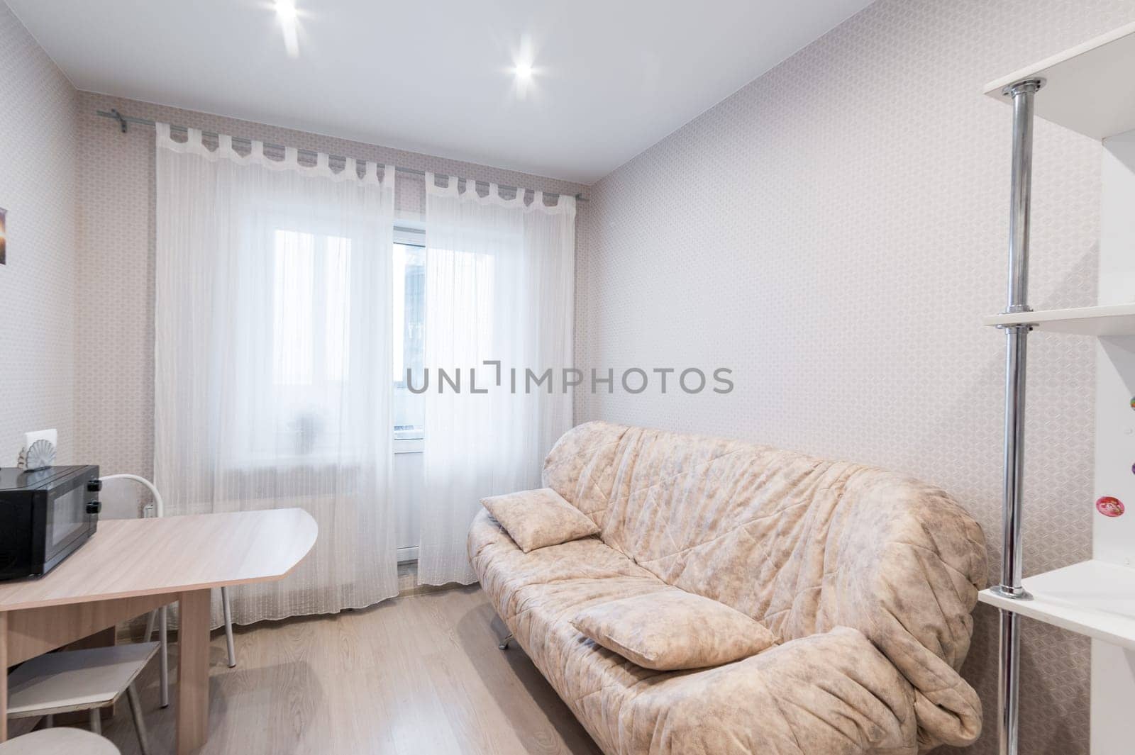 Russia, Moscow- June 11, 2019: interior room apartment. standard repair decoration in hostel. modern kitchen, dining area