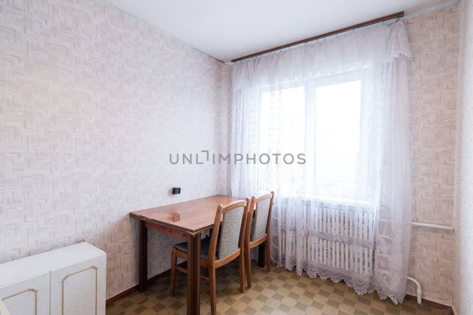 Russia, Moscow- June 11, 2019: interior room apartment. standard repair decoration in hostel. modern kitchen, dining area