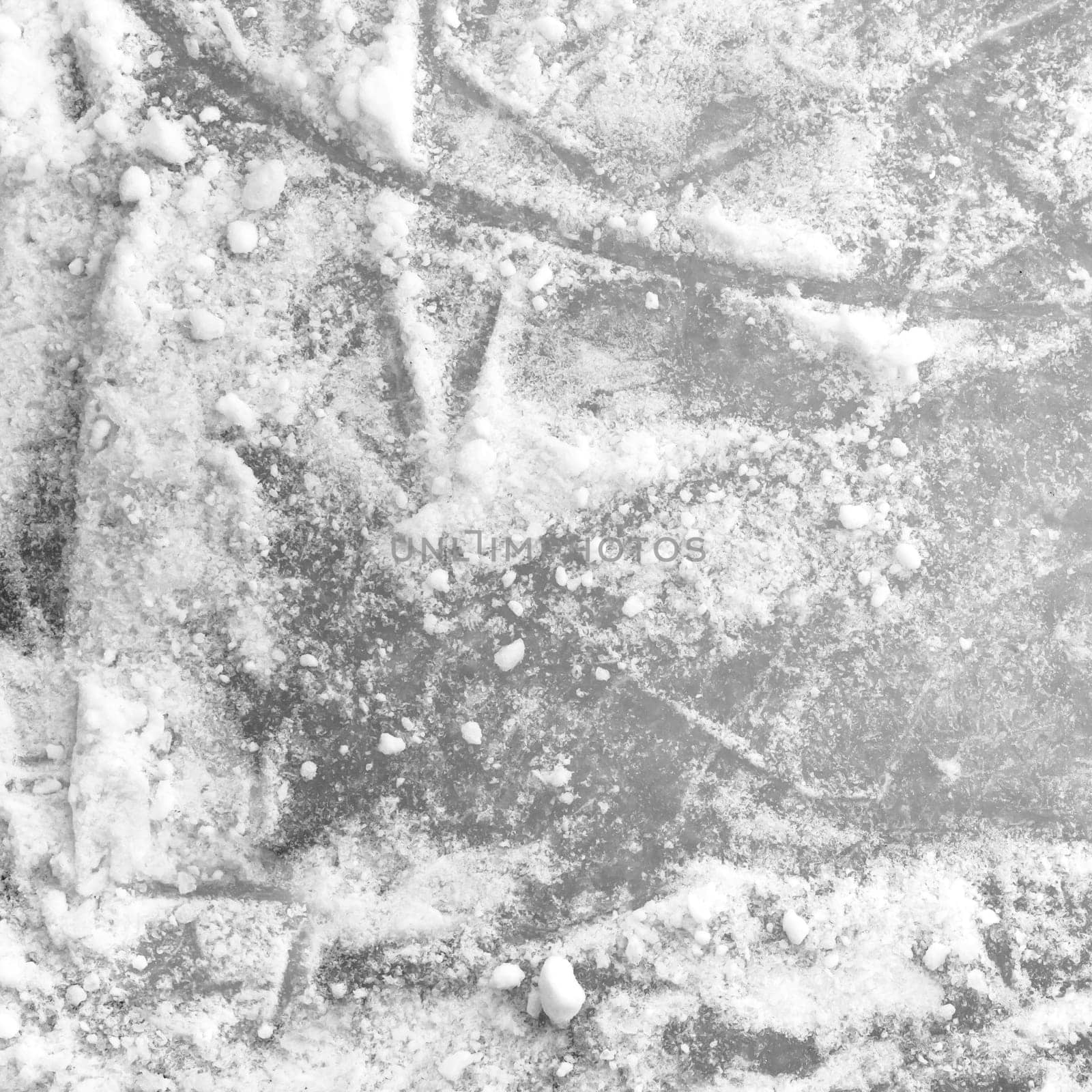 Ice background with marks from skating and hockey. Winter sports wallpaper.