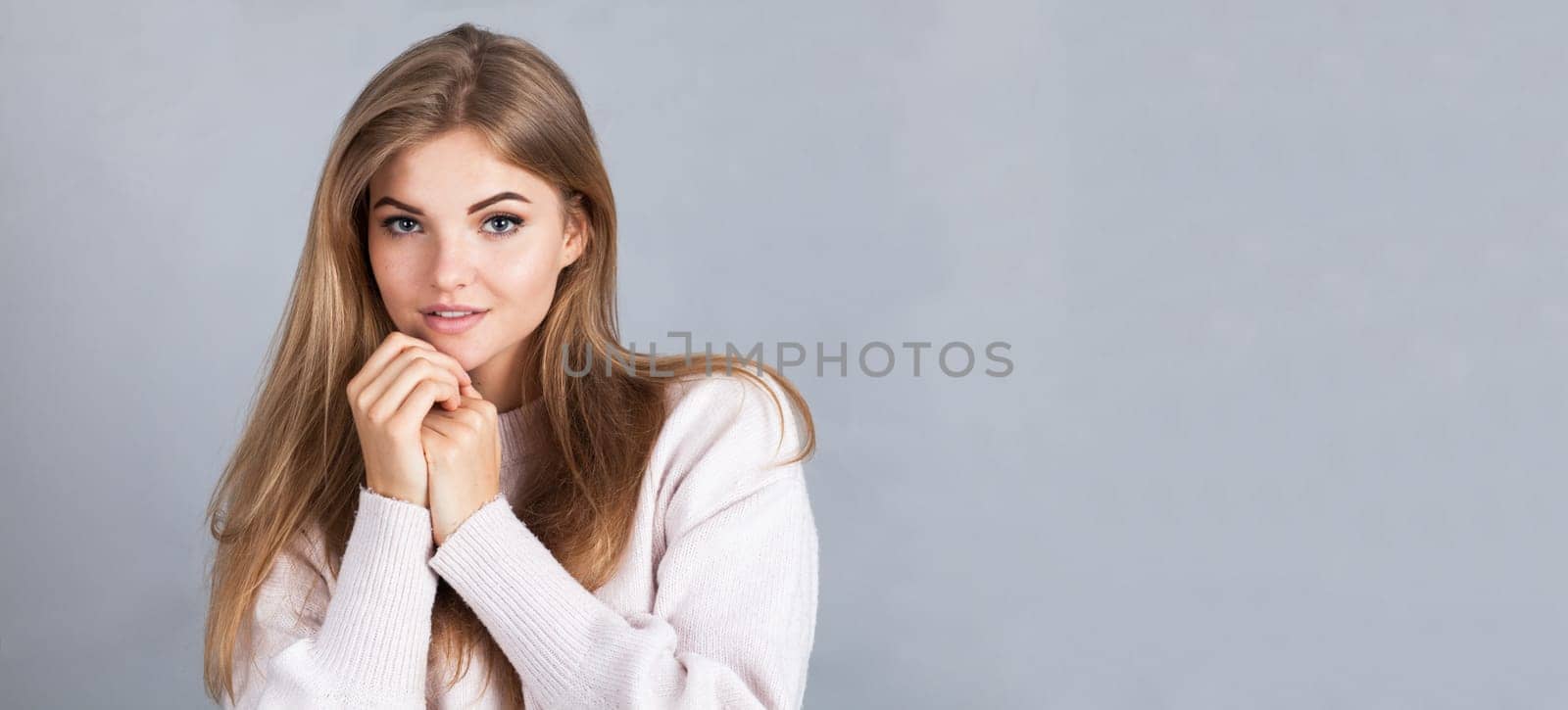 Banner of an attractive blonde, isolated on grey