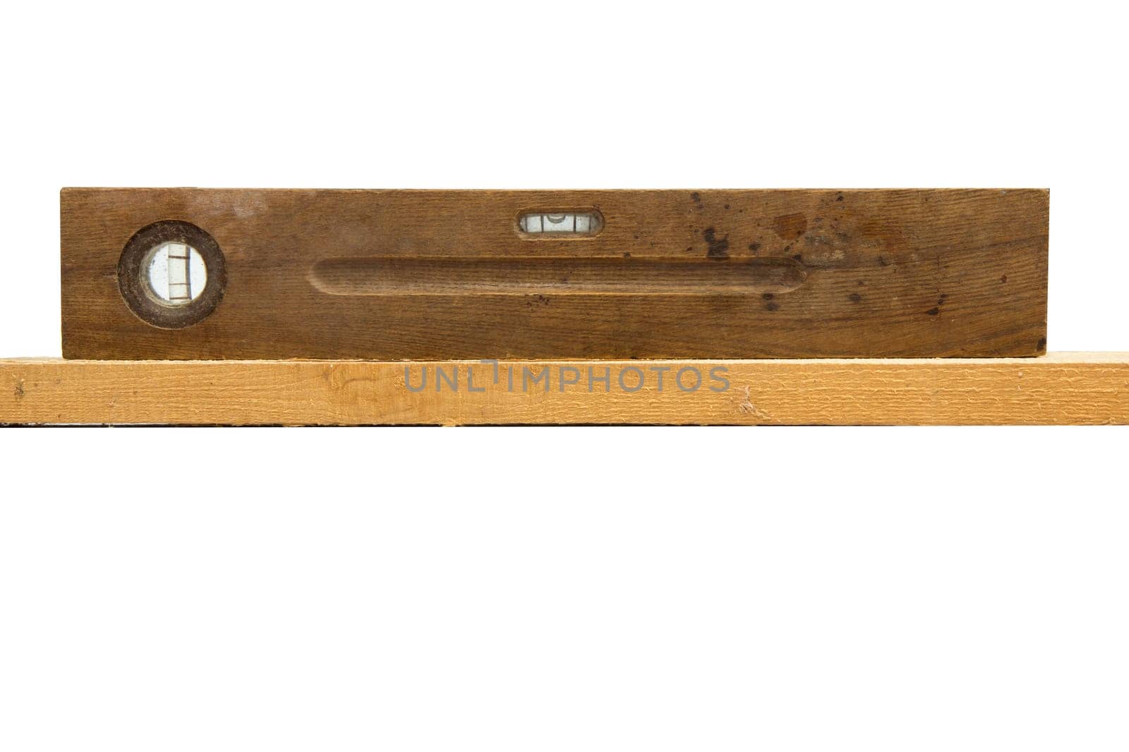 Old vintage wood ruler level meter on the white background